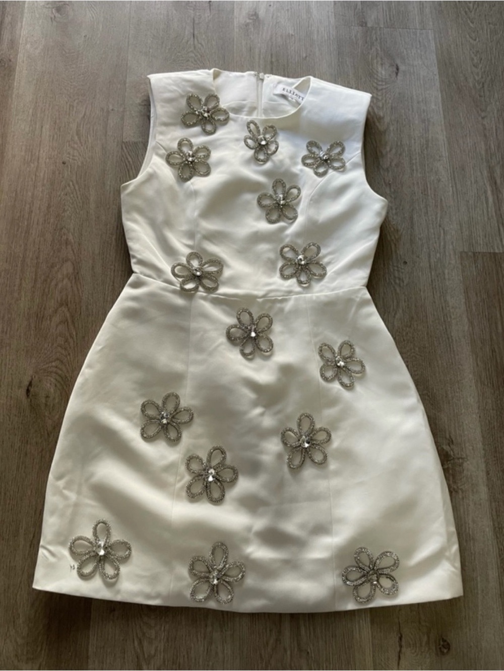 Elliatt White Sleeveless Mini Dress with Silver Floral Embellishments